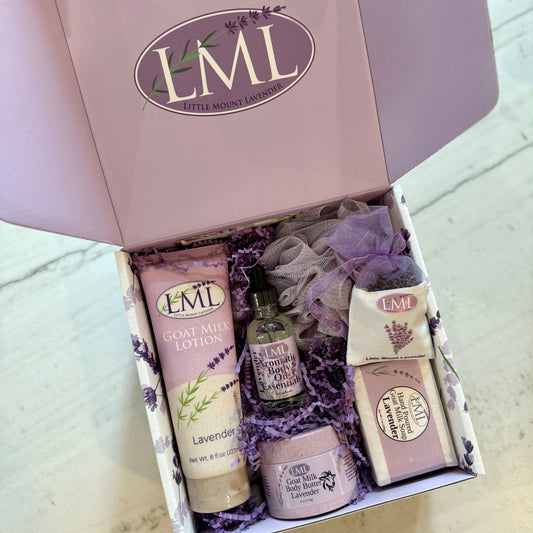 Open purple Little Mount Lavender gift box with lotion, soap, body butter, and body oil.