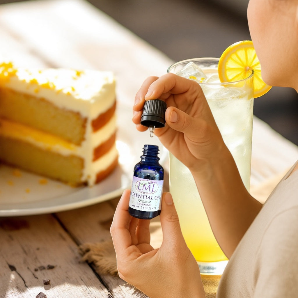 Little Mount Lavender food-grade essential oil in a blue glass bottle held by a person next to cake and lemonade.