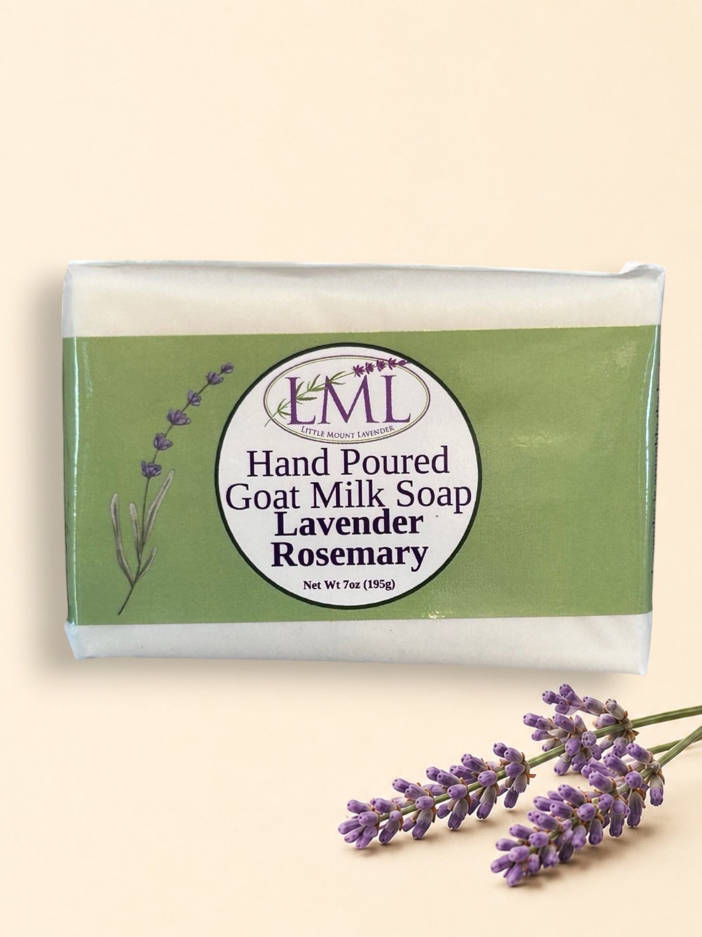 Little Mount Lavender handcrafted goat milk soap bar with lavender and rosemary scent, set against a garden background.