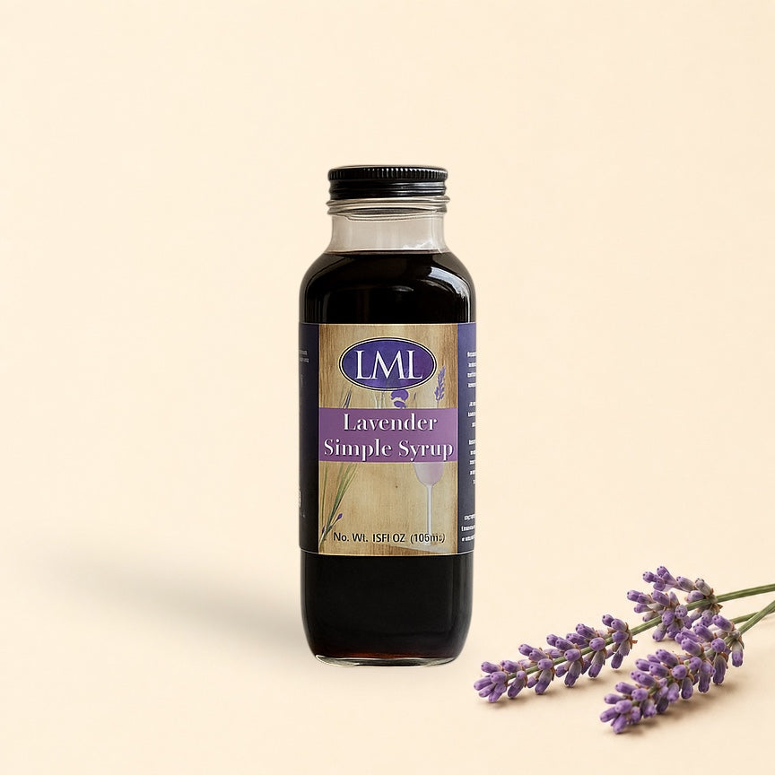 Bottle of LML Lavender Simple Syrup on a marble surface with a beige background