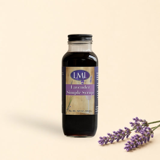 Bottle of LML Lavender Simple Syrup on a marble surface with a beige background