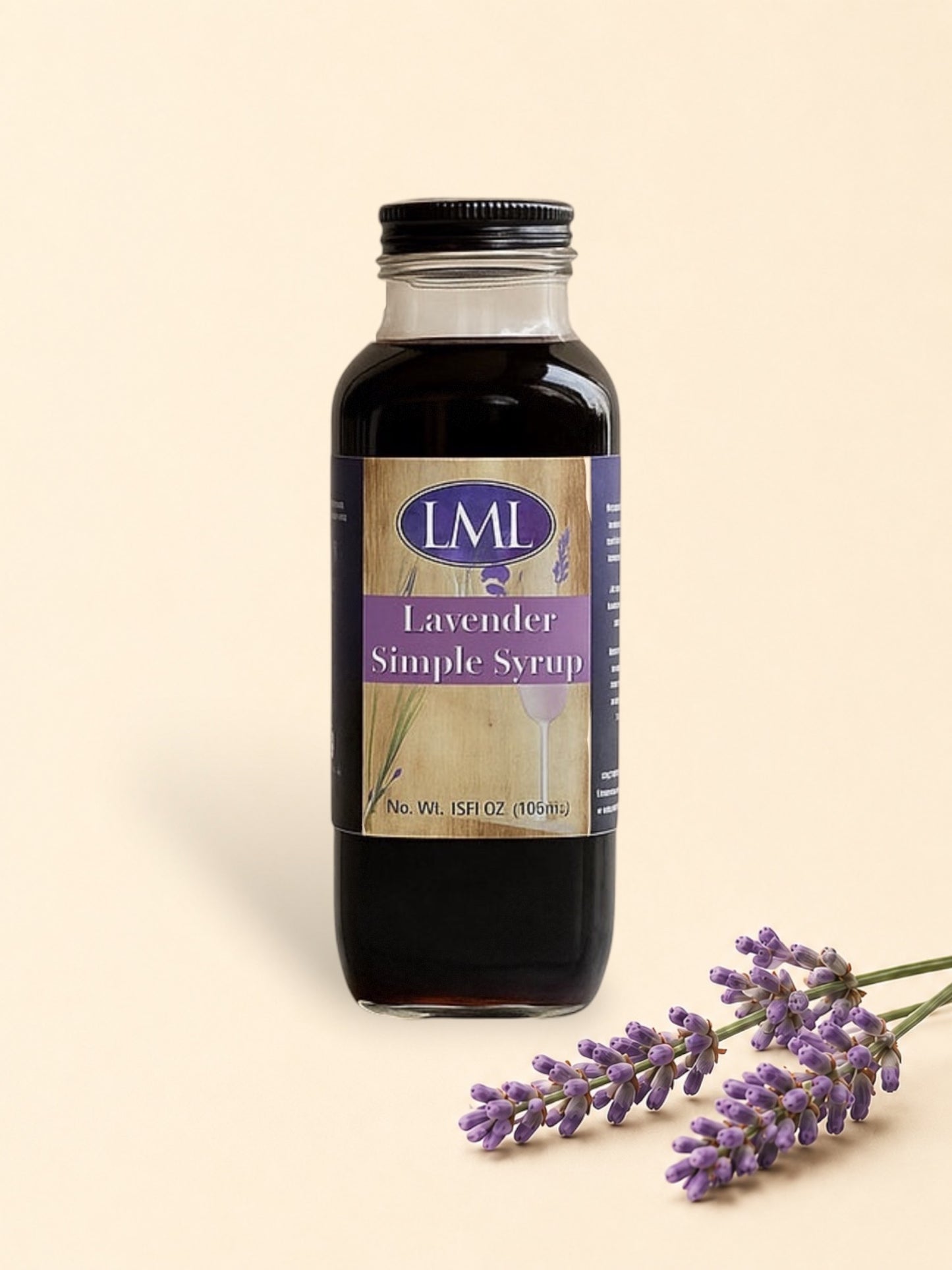 Bottle of LML Lavender Simple Syrup on a marble surface with a beige background
