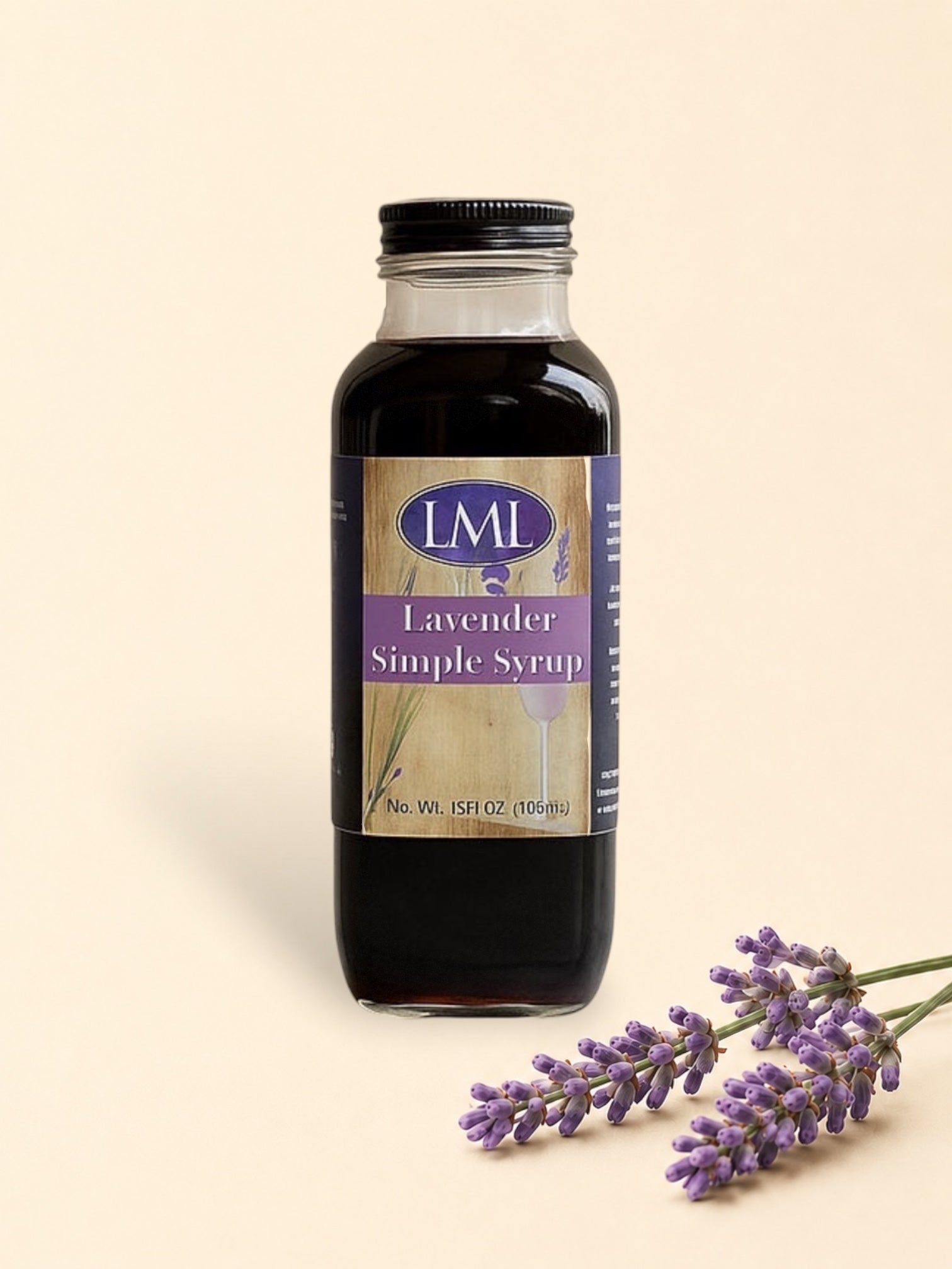 Bottle of LML Lavender Simple Syrup on a marble surface with a beige background