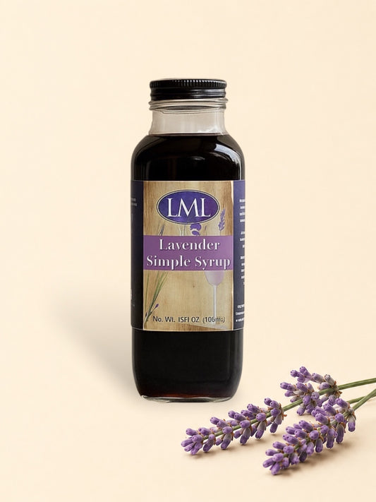 Bottle of LML Lavender Simple Syrup on a marble surface with a beige background