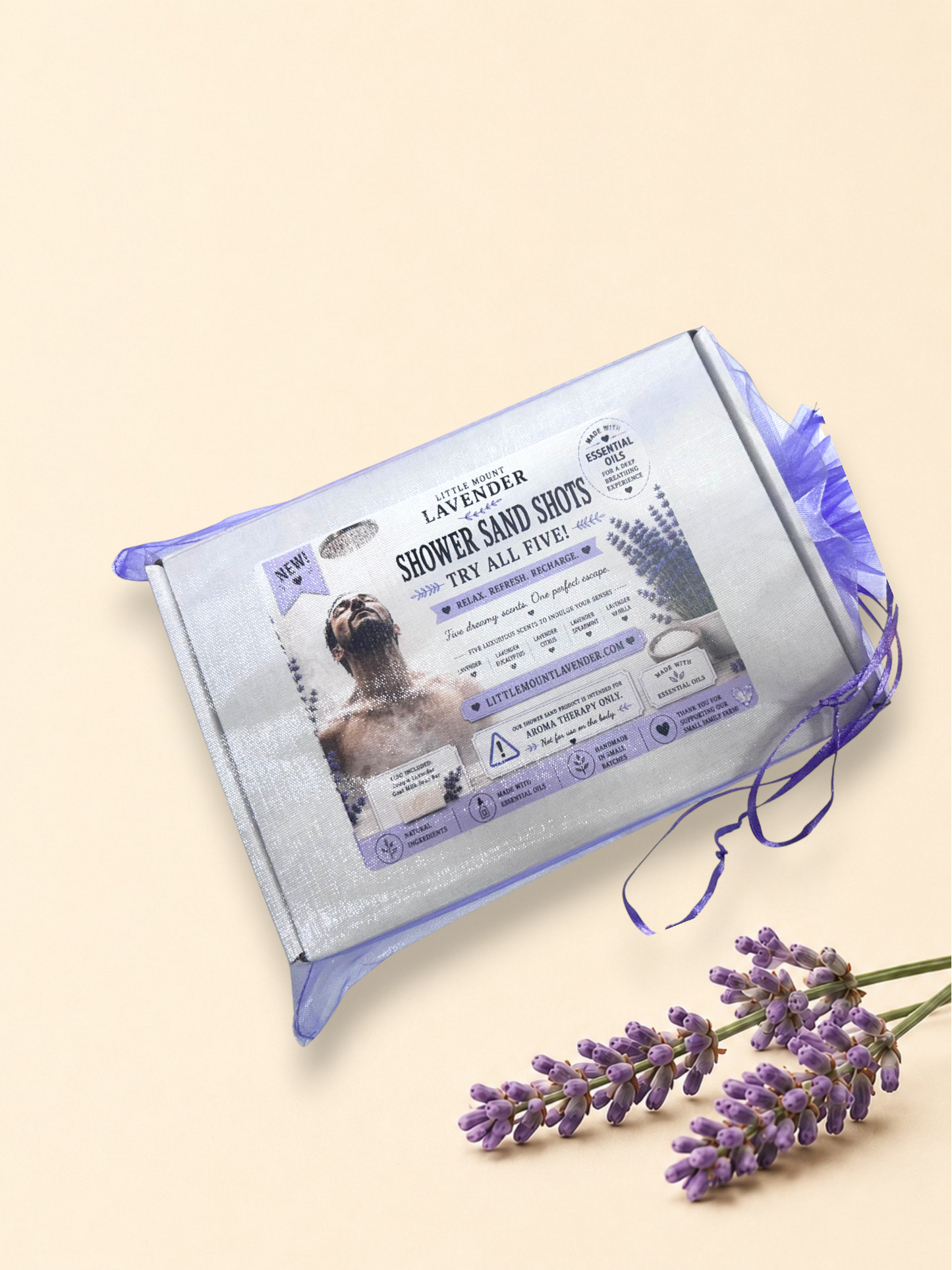 Closed Shower Sand Shots sampler box with a purple ribbon and illustrated label.