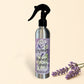 Silver spray bottle with lavender hydrosel label on a tiled wall background