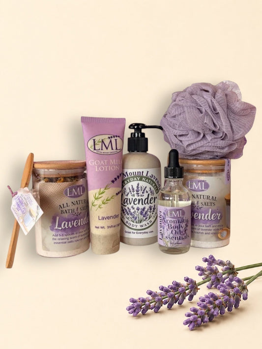 Little Mount Lavender bath and body gift set featuring goat milk lotion, body wash, aromatic oil, salts, and a sponge.