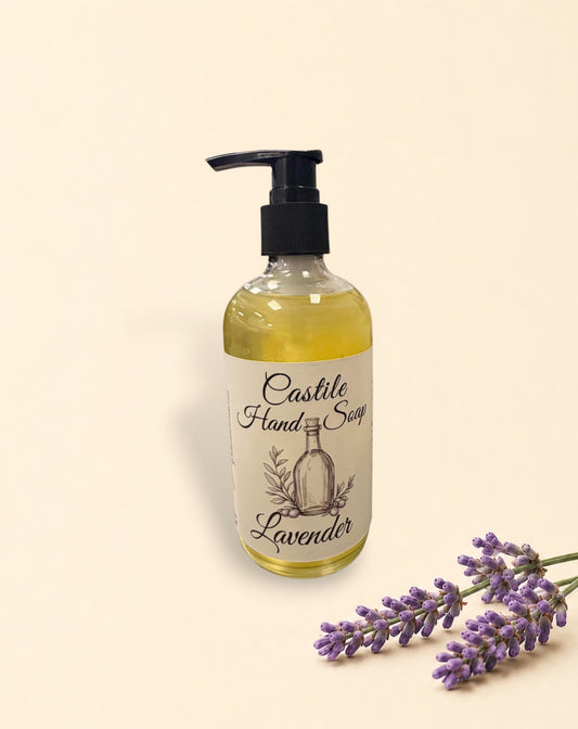Two Little Mount Lavender castile hand soap bottles with pump dispensers and fresh lavender sprigs on beige background