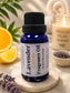 Little Mount Lavender fragrance oil in a cobalt blue glass bottle with a dropper cap, next to fresh lavender sprigs.