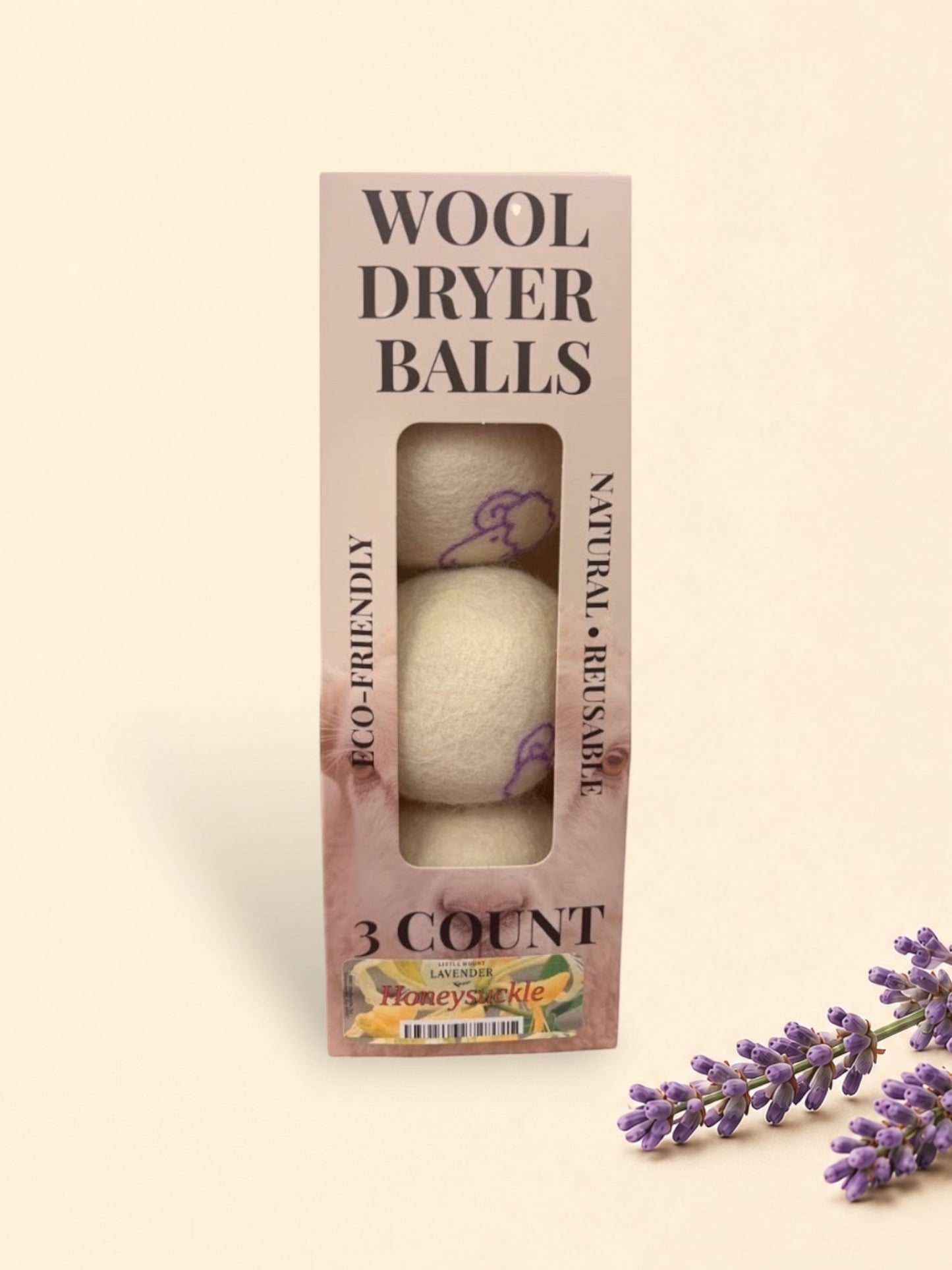 Little Mount Lavender dried purple floral sprigs resting on a minimalist soft beige background