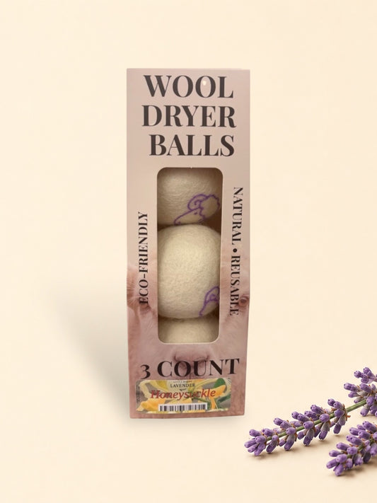 Little Mount Lavender dried purple floral sprigs resting on a minimalist soft beige background