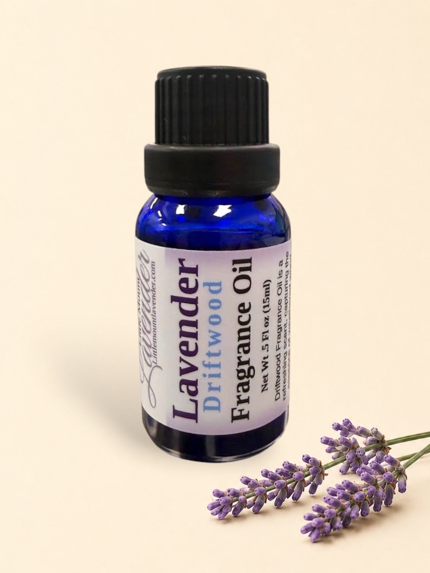 Little Mount Lavender Driftwood fragrance oil in a cobalt blue glass bottle with a black dropper cap