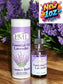 Little Mount Lavender 1 oz essential oil bottle and packaging tube with purple lavender flowers in the background.