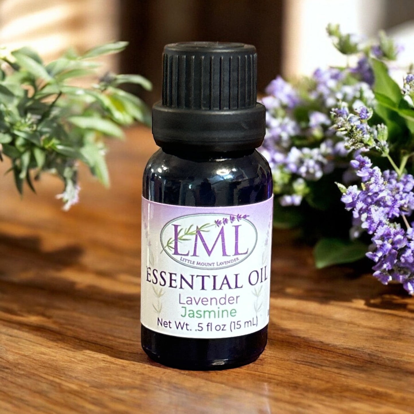 Little Mount Lavender essential oil and jasmine fragrance oil in a 15ml amber glass bottle with purple floral decor.
