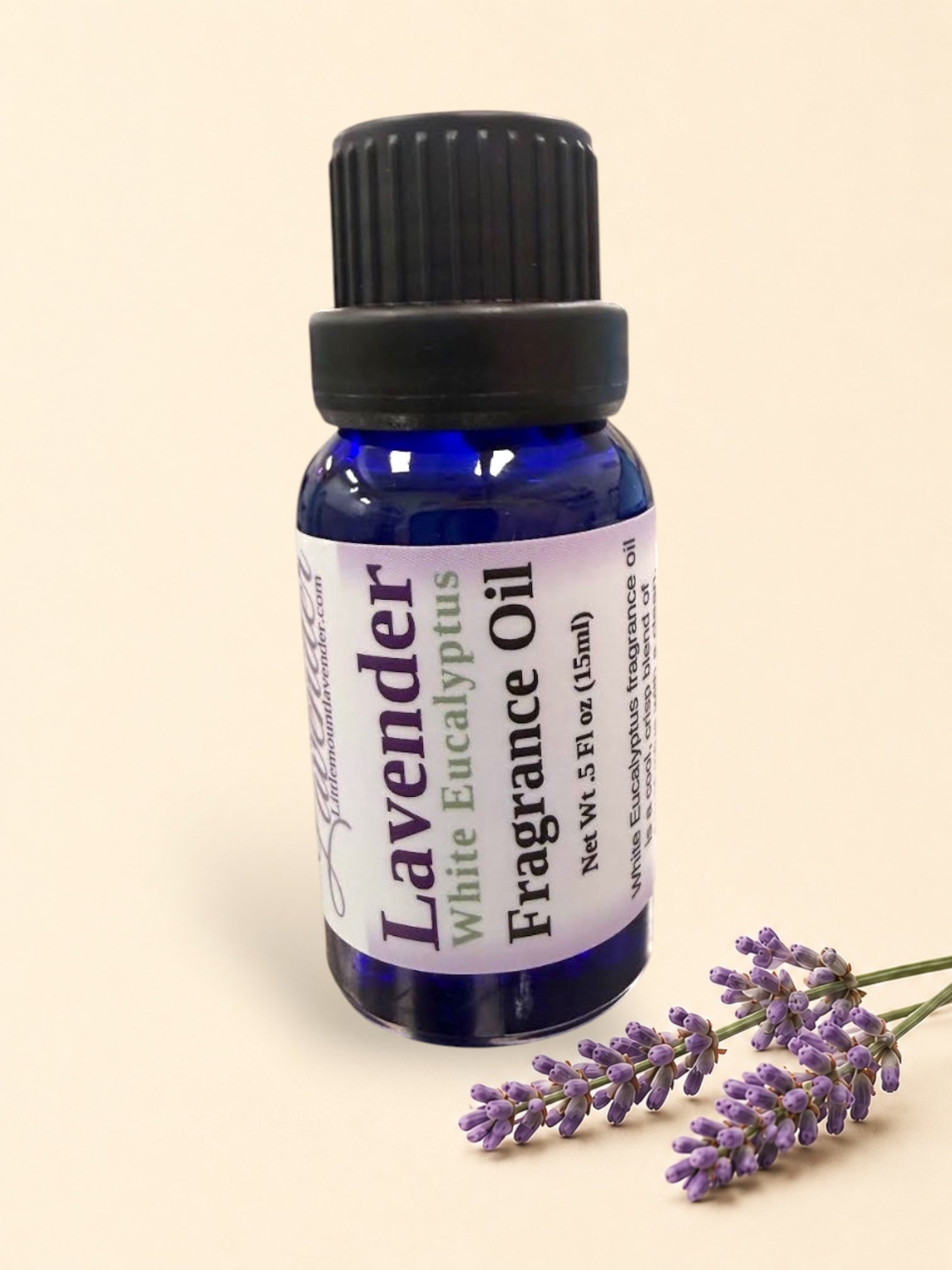 Little Mount Lavender Lavender White Eucalyptus fragrance oil in a cobalt blue glass bottle with a black cap.