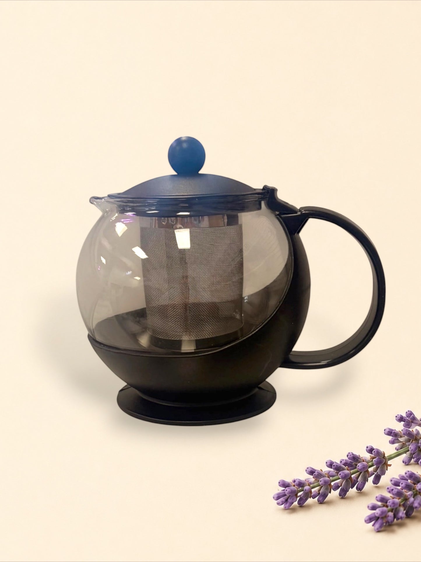 Little Mount Lavender glass tea infuser pot with a matte black frame, handle, and stainless steel mesh filter.