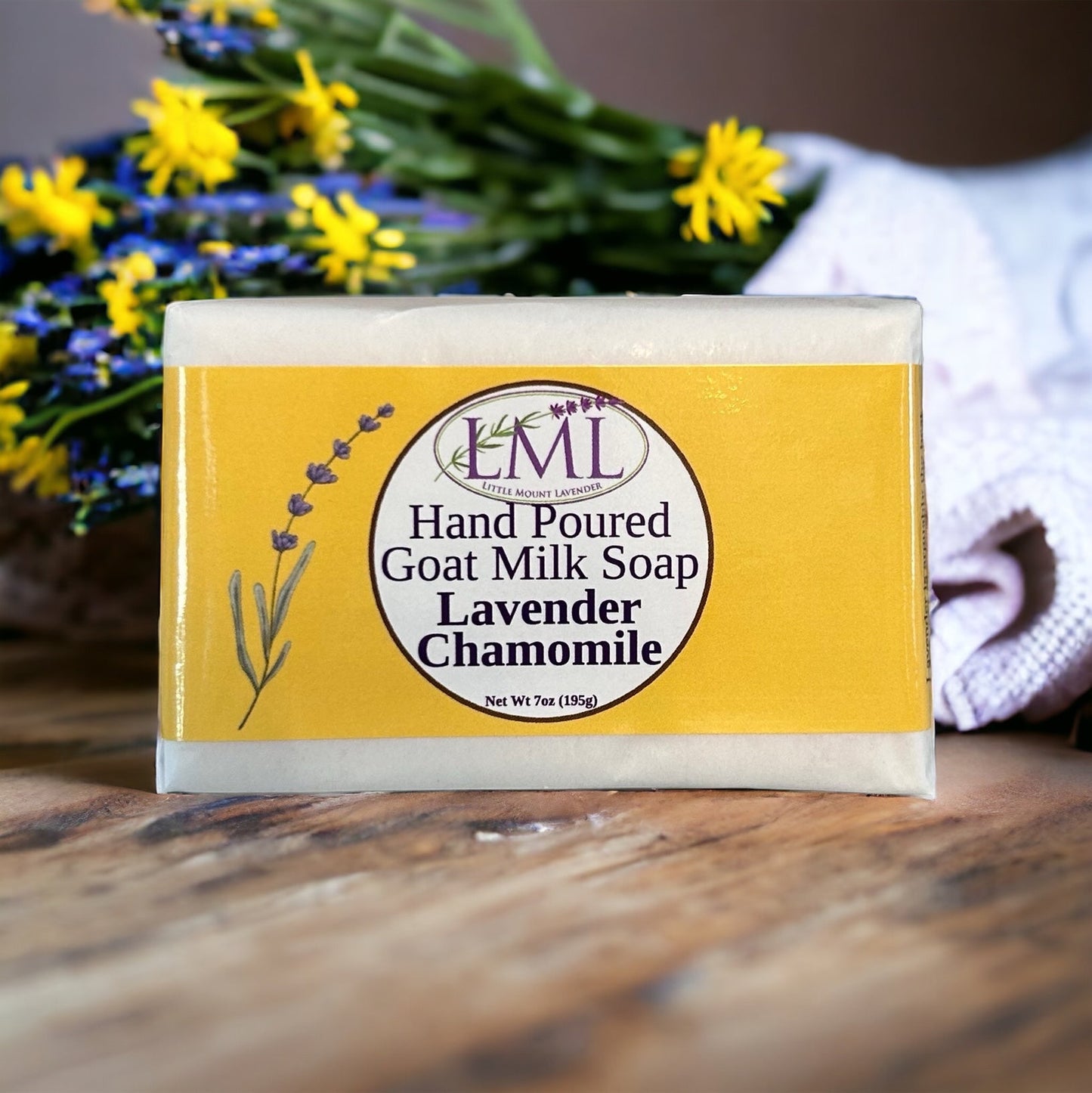 Little Mount Lavender handcrafted goat milk soap with calming lavender and chamomile scent on a rustic wooden surface.