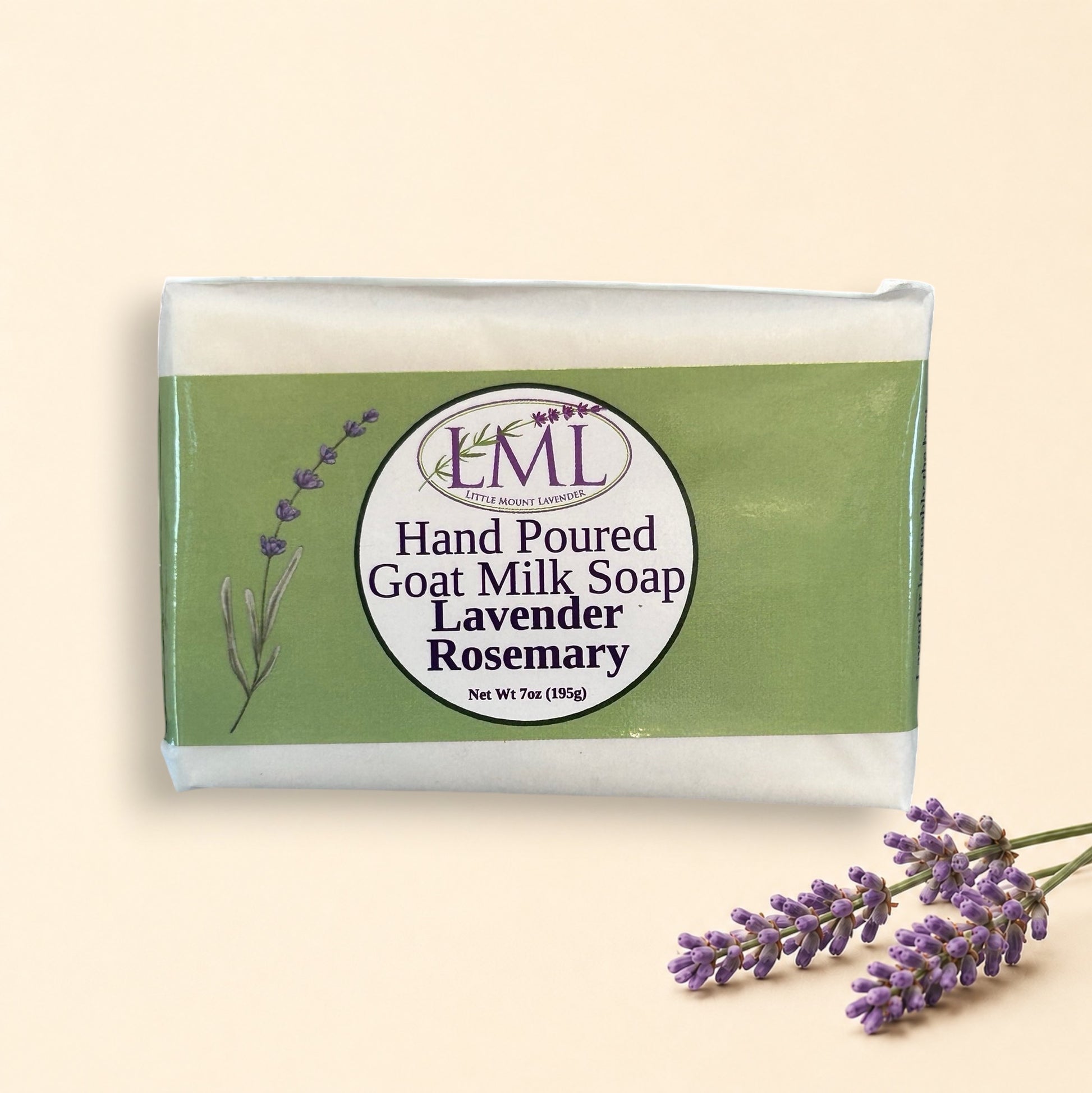 Little Mount Lavender handcrafted goat milk soap bar with lavender and rosemary scent, set against a garden background.