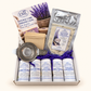 Open herbal tea starter box with five tea samples, infuser, paper tea bags and lavender sugar.