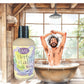 Little Mount Lavender Herbal Vitality Body Wash in a bottle next to a man enjoying a refreshing shower in a rustic bath