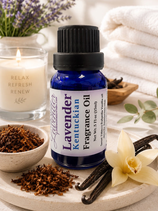 Little Mount Lavender Kentuckian fragrance oil in a cobalt blue glass bottle with a sprig of fresh lavender flowers.