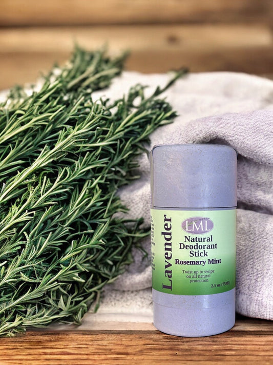 Little Mount Lavender natural deodorant stick in a biodegradable wheat straw container with fresh rosemary sprigs.
