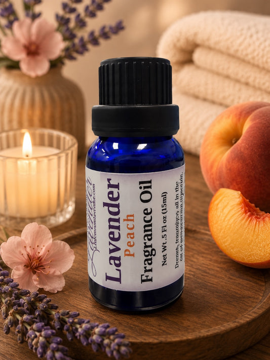 Little Mount Lavender Peach fragrance oil in a 15ml cobalt blue glass bottle with fresh lavender sprigs