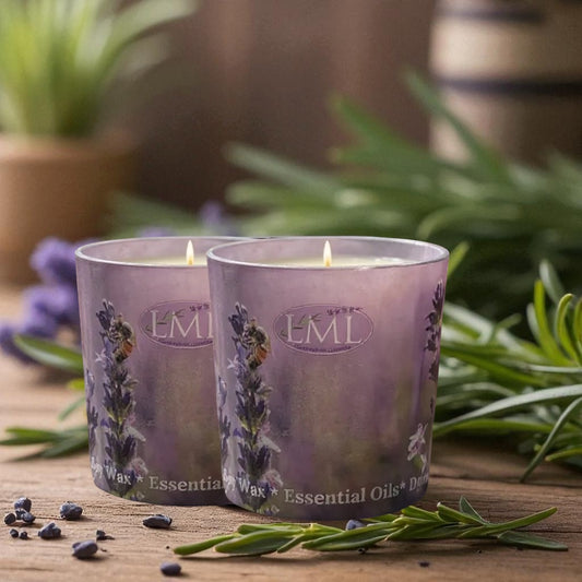Little Mount Lavender twin pack soy wax candles in purple glass jars with essential oils on a rustic wooden table.