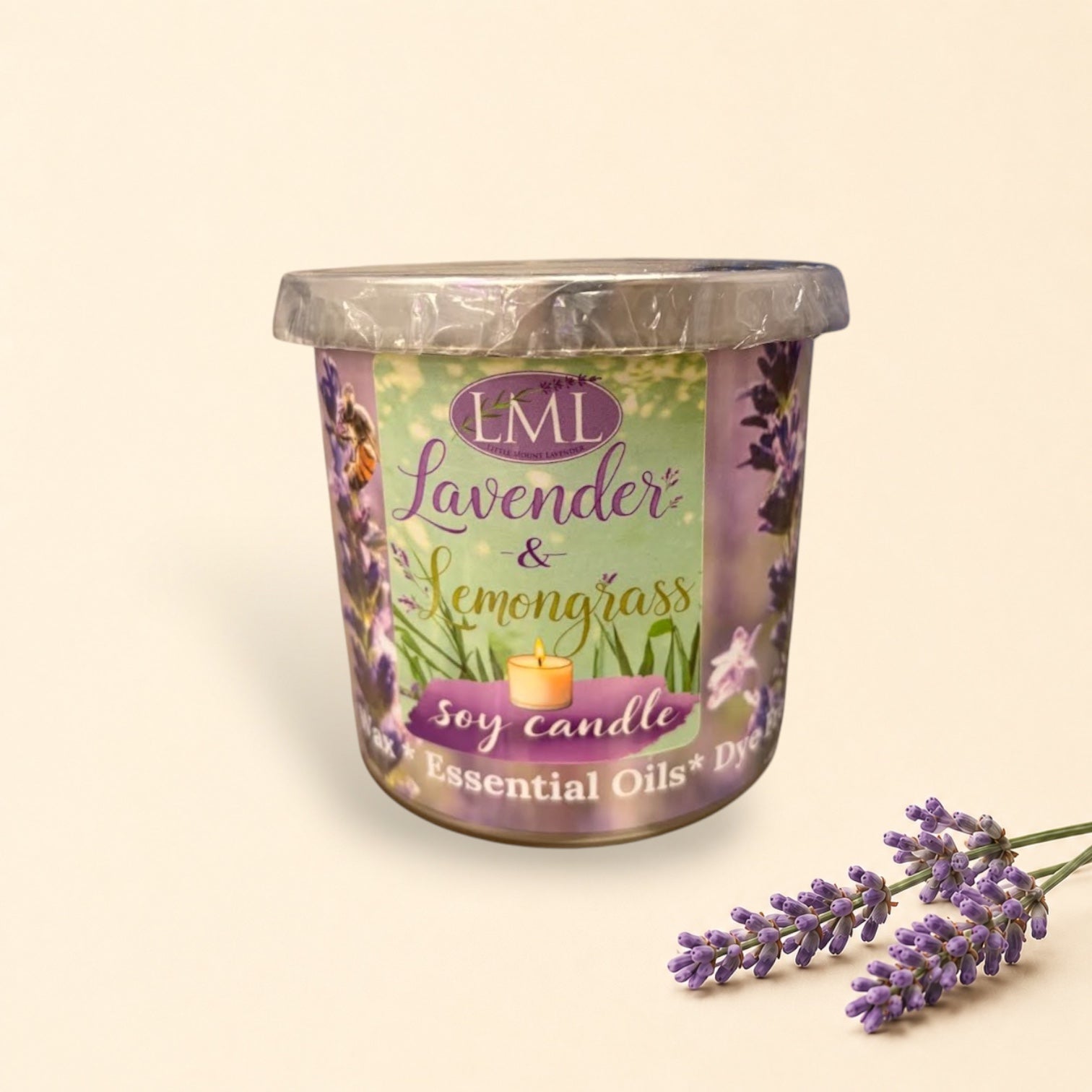Little Mount Lavender soy candle with lavender and lemongrass scent in a decorative glass jar on a wooden surface.